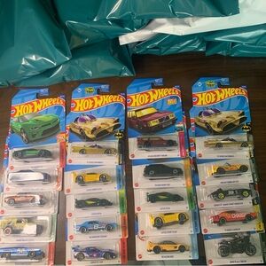 Hot Wheels 2022  Die-Cast Cars, 4 each  Hot Wheels to each mystery wheels bag.